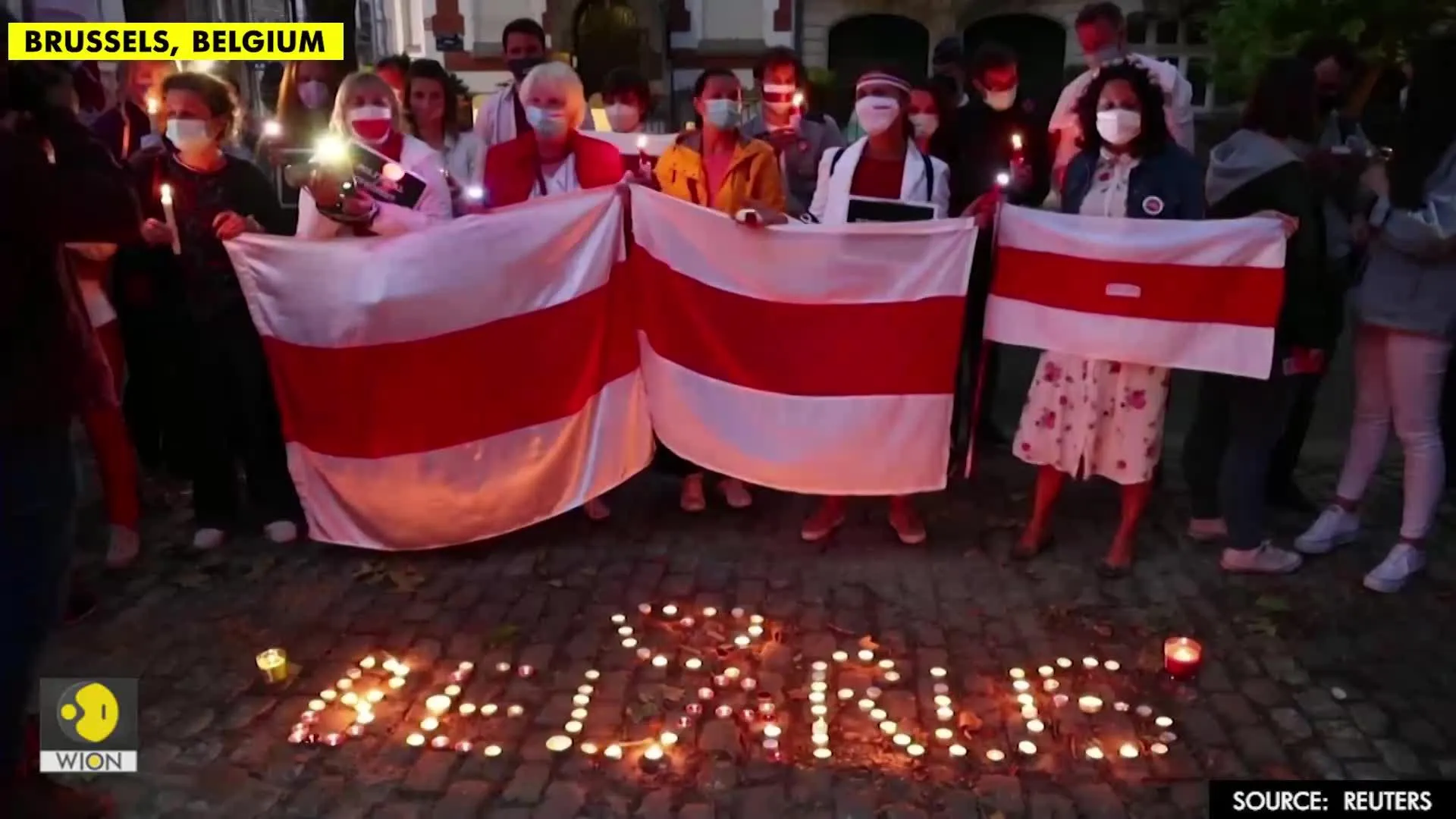 Protesters hold candlelight vigil outside Belarus embassy in Brussels