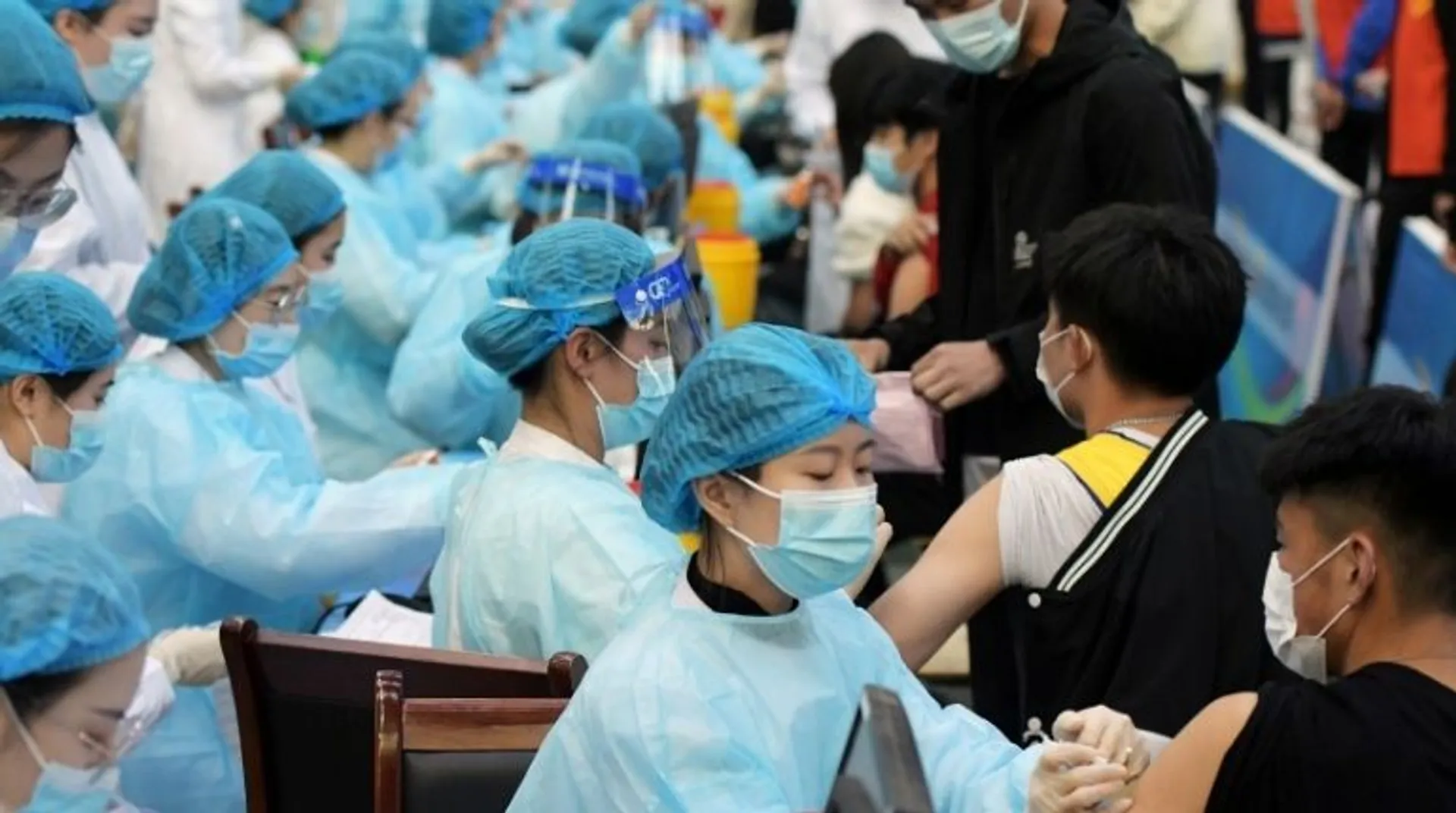 China ramps up vaccinations, but uneven rollout leaves borders closed