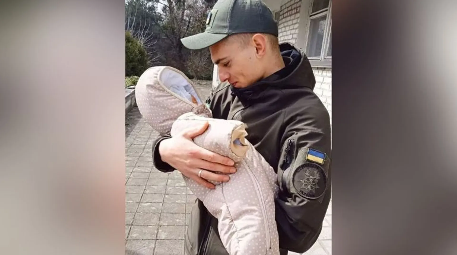 Moment of joy: Ukrainian soldier holds new-born baby in arms for first time