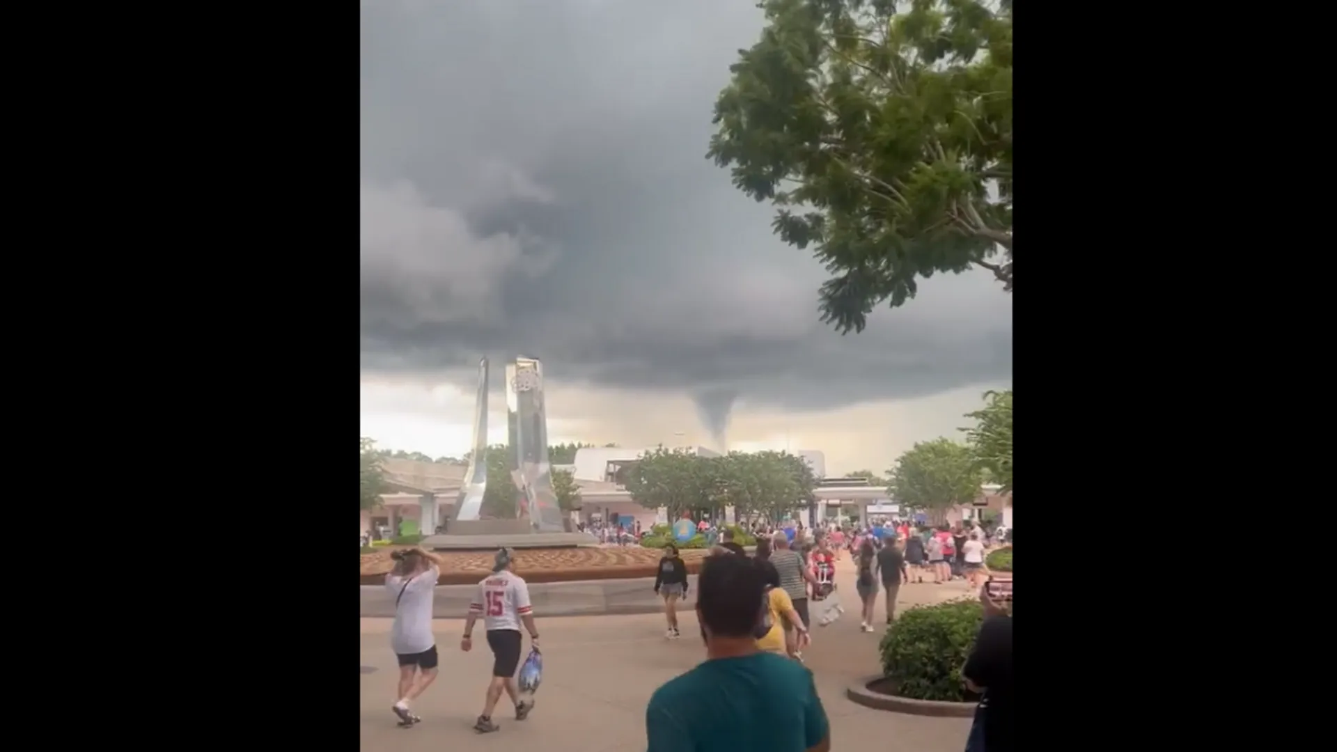 Watch: People seek shelter as a funnel-shaped cloud looms over Disney World, US