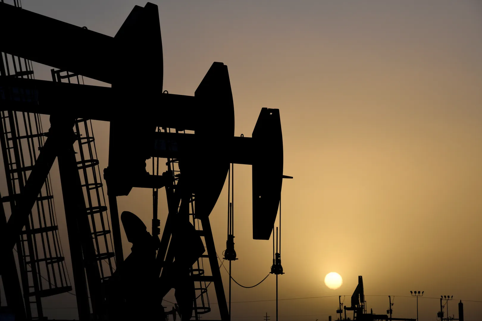 Oil prices ease to trade near two-month lows on China demand fears, dollar strength