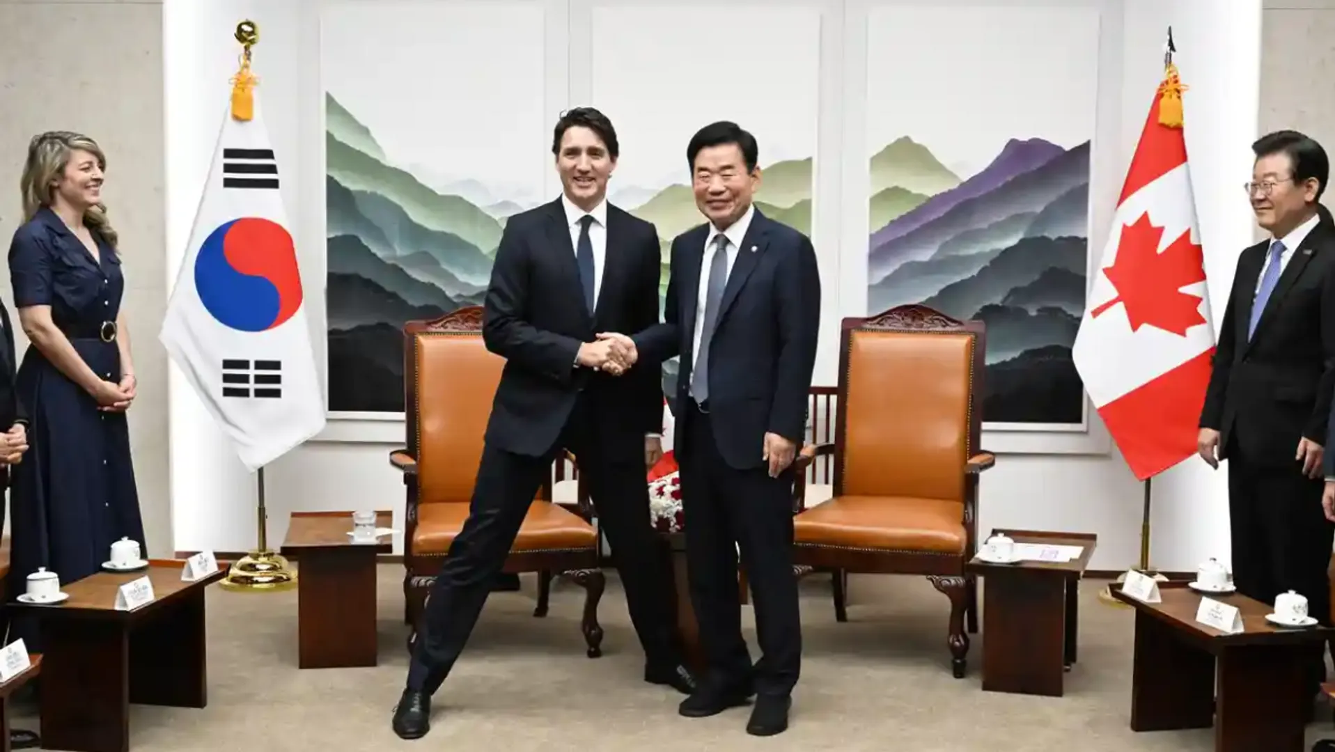 Trudeau’s ‘manner legs’ pose with Korean politician slammed as another gaffe by critics