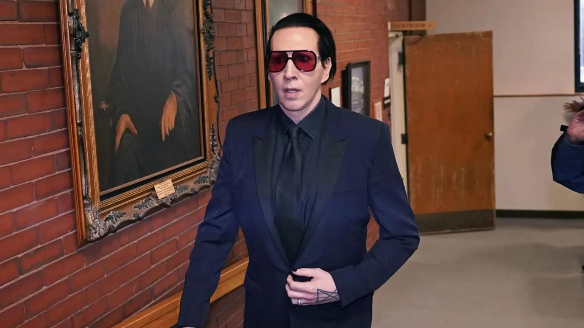 Marilyn Manson fined for blowing nose on concert camerawoman