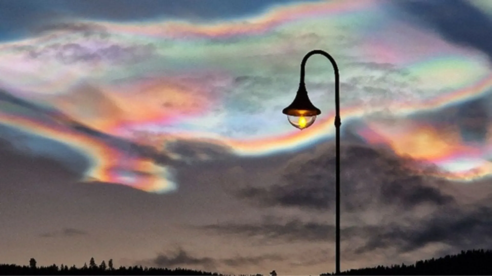 Images show breathtaking rainbow-coloured clouds spreading stunning colours in Arctic skies