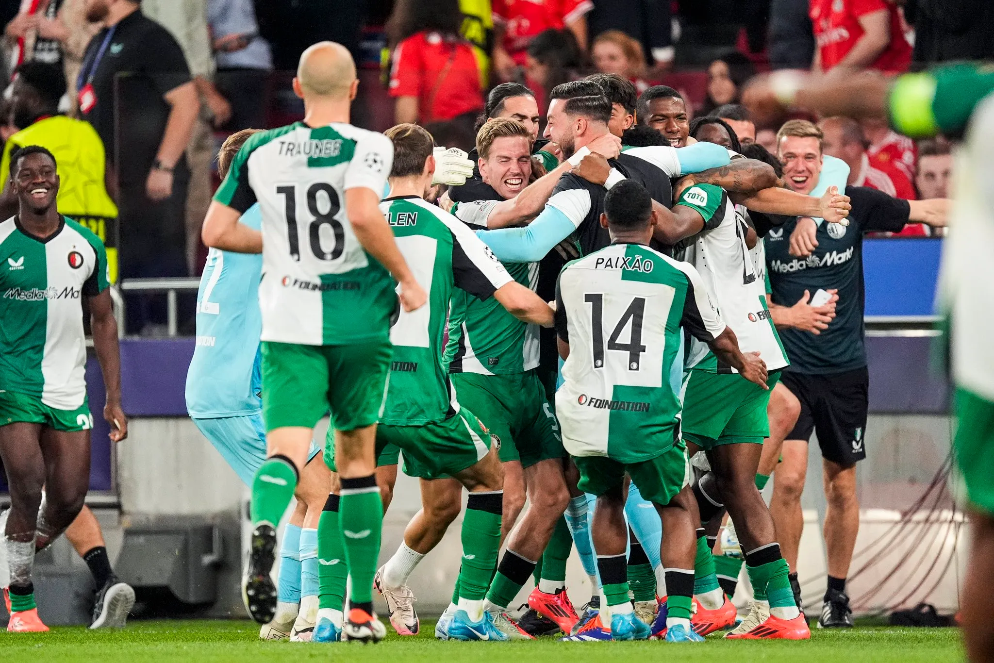 Feyenoord players celebrate a goal against Benfica in the Champions League- Sportz Point.com