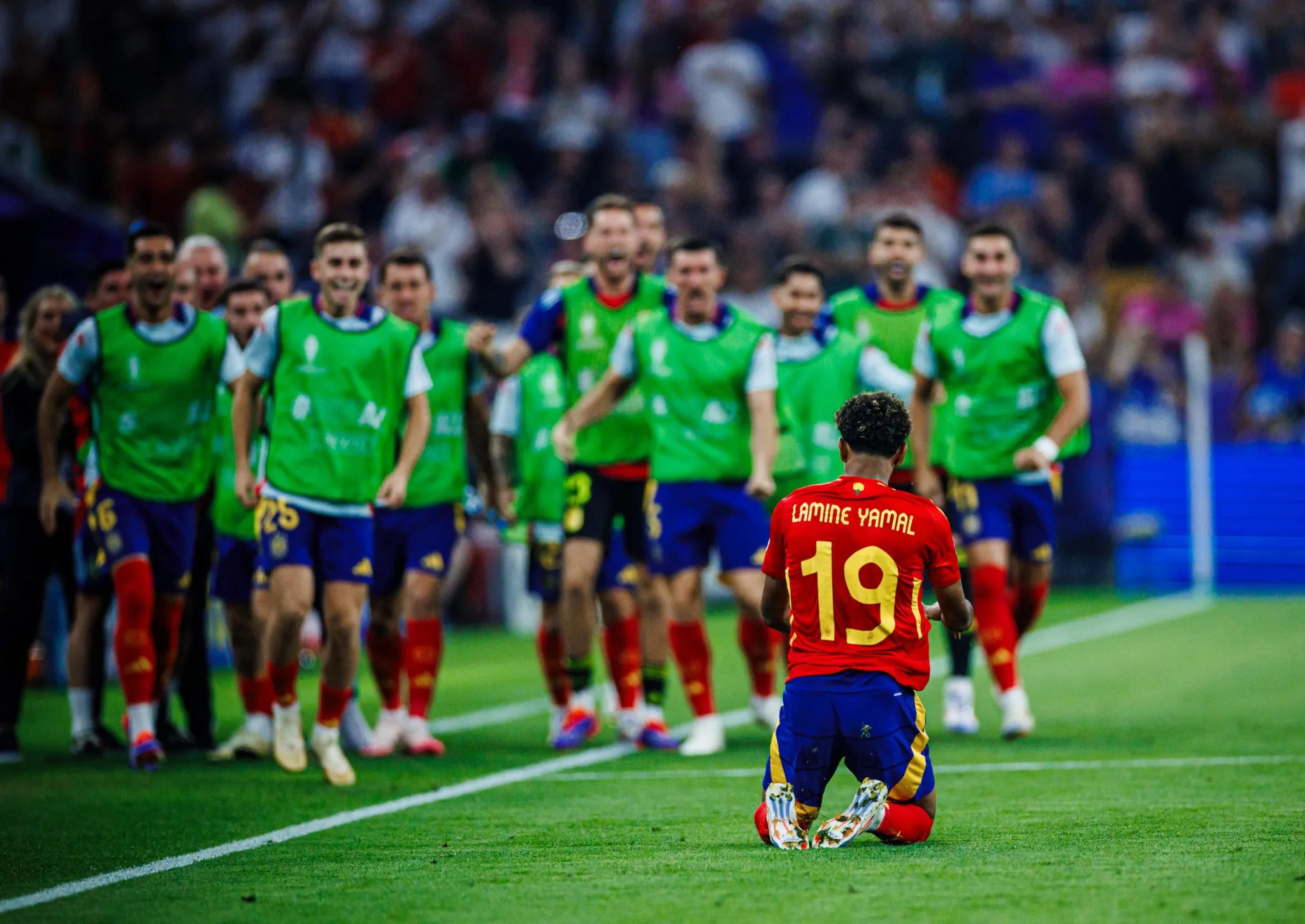 Lamine Yamal is greeted by his teammates after his stunning goal against France in the Euro 2024 semi-finals - sportzpoint.com