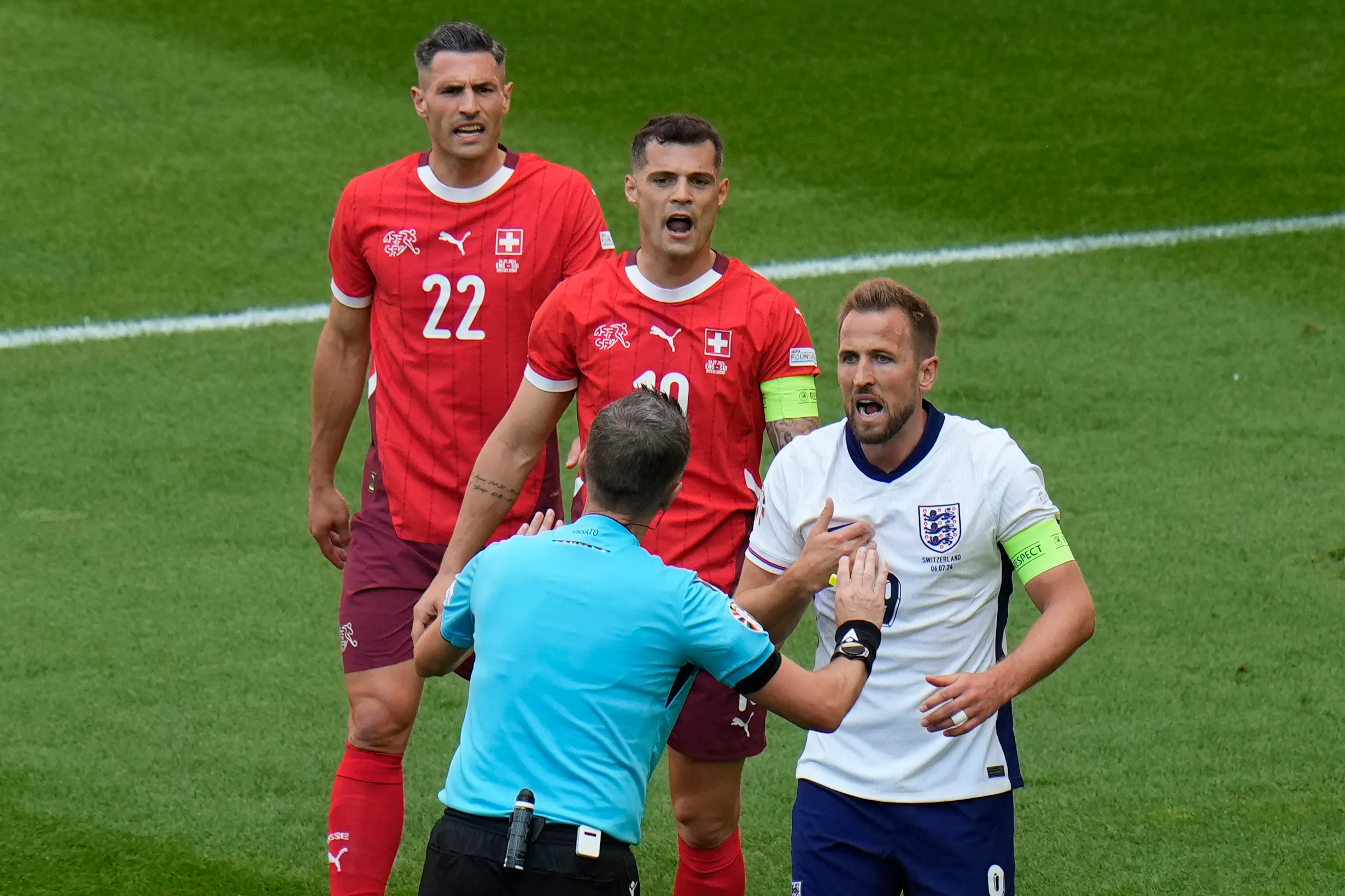 Kane argues with the referee