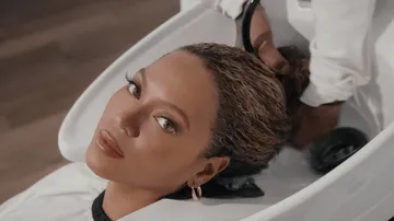 Beyoncé Promotes New Natural Hair Care Line While Embracing Her Own Natural Hair