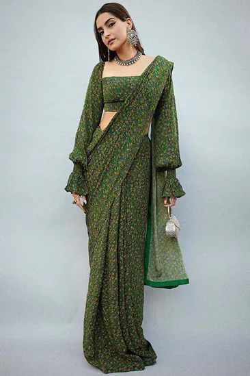 Sonam Kapoor Ahuja steps out in a printed green Masaba sari | VOGUE India