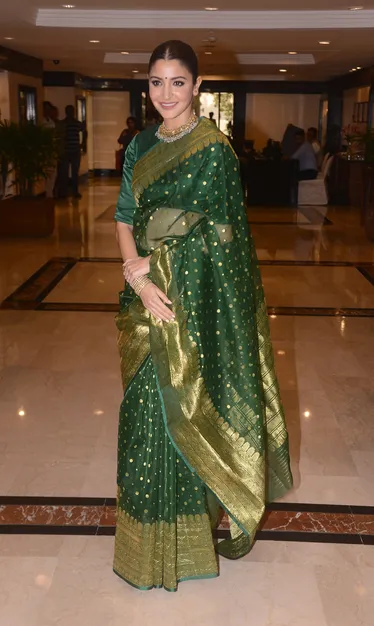 Anushka Sharma in a green saree at Priyadarshini Academy Global Awards