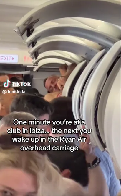 The video, which has been viewed 592,000 as of Sunday, was posted by Australian house music producer Dominic Matheson showing the partied-out passenger secured in the overhead bin. 