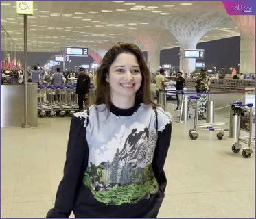 Tamannaah cuts the cake with a fan at the airport