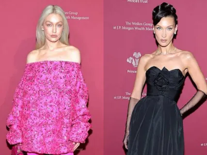 Gigi Hadid and Bella Hadid arrived at The Prince’s Trust Gala in pink and black outfits, respectively. See how the sisters pulled off two bold styles.
