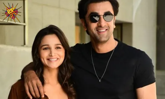 Alia Bhatt glows as she shows off her baby bump in a photo with Spouse Ranbir Kapoor.