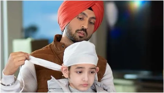 Diljit Dosanjh shares an adorable picture with on-screen son Shinda Grewal from their forthcoming film 'Honsla Rakh'!