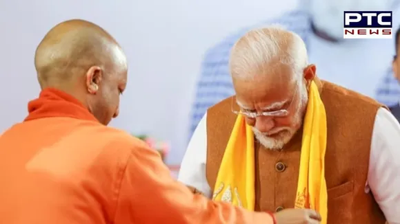 PM Modi in Varanasi Yogi Adityanath sharing stage with the prime minister..jpg