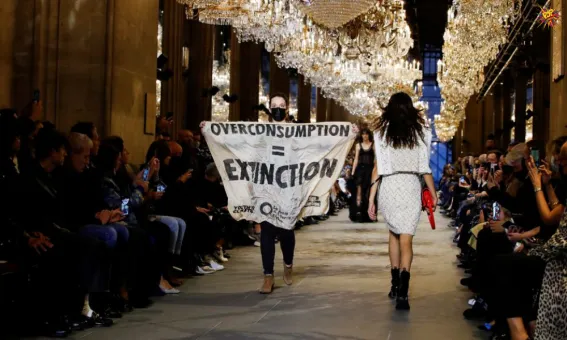 Louis Vuitton Show in Paris gets disrupted by a Climate change Protestor