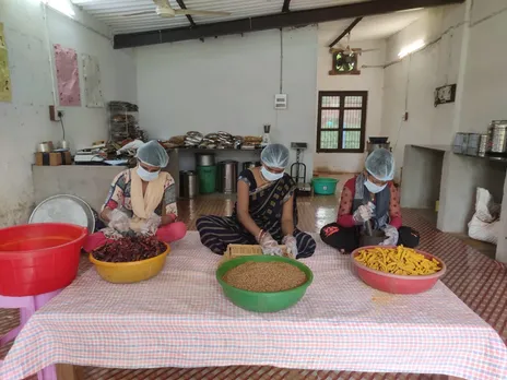 Women grinding spices