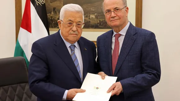 Palestinian president Mahmud Abbas (L) presents his new prime minister, Mohammed Mustafa, a long-trusted adviser on economic affairs, at the Palestinian Authority's headquarters in Ramallah