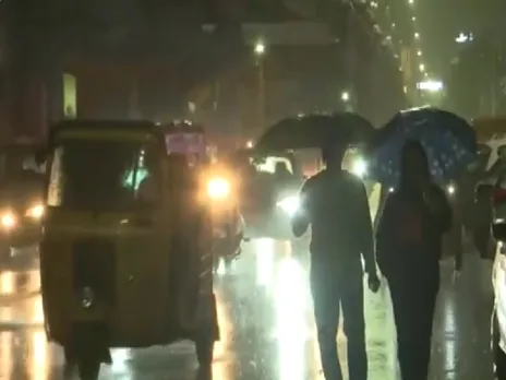 Sparkling rain in night city, watch video