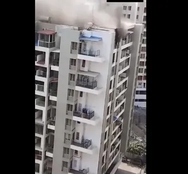 Fire breaks out in 11-storey apartment near school