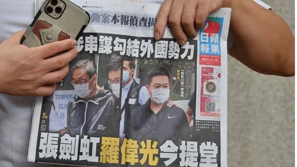 Slap on China's repressive face as thousands queued up to buy the last copy of Apple Daily