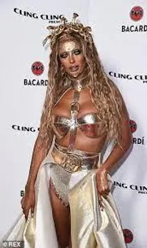 Maya Jama looks sensational in metallic lingerie