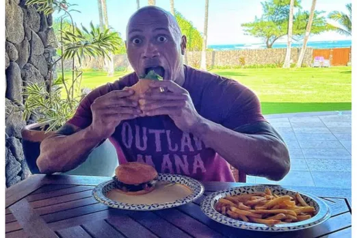 The Rock, Dwayne Johnson, teases his cheat-meal morning.