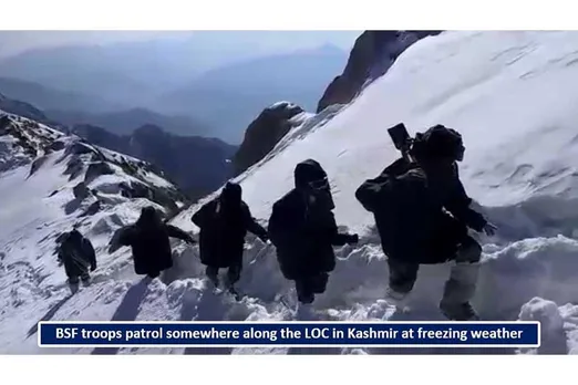 BSF troops patrol somewhere along the LOC in Kashmir at freezing weather