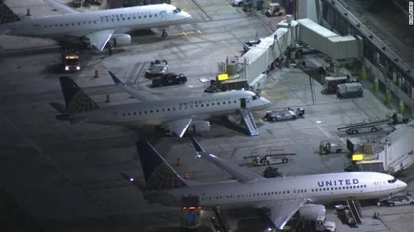A man jumps out of an aircraft as it was taxing in Los Angeles airport