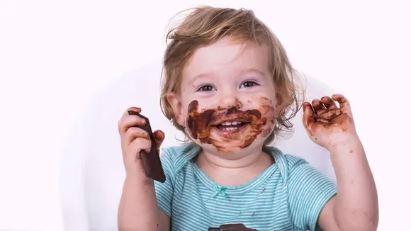 Baby eating chocolate