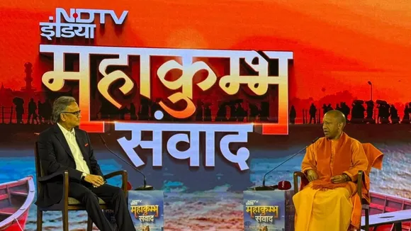 NDTV Editor-in-Chief Sanjay Pugalia with CM Yogi Adityanath at the NDTV India Mahakumbh Samvaad event