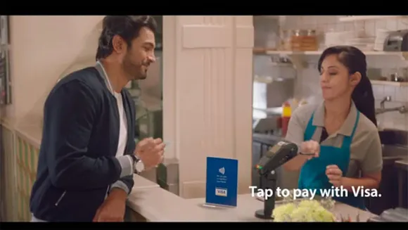 'Tap to pay with Visa. Just like that.' shows the shift from dipping to tapping of the card