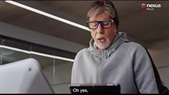 Amitabh Bachchan helps a customer pick her dress in Nexus Malls' latest ad film