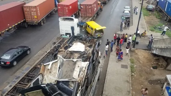 Miraculous Escape for Passengers as Truck Overturns on Bus in Lagos