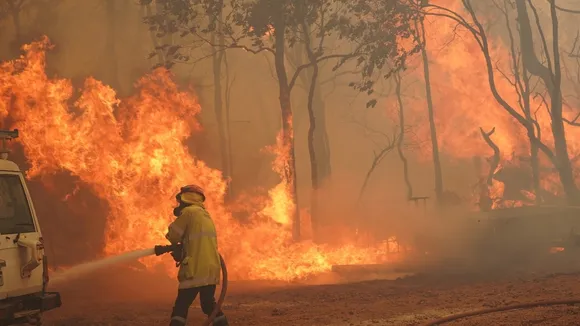 Urgent Alert: Commuters Warned as Bushfire Nears Homes, Firefighters Battle Blaze