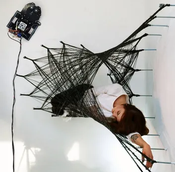 Check these spiderbots weave ingenious labyrinth with carbon fiber