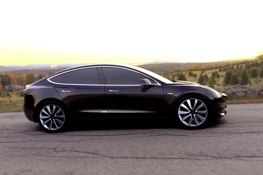 Tesla CEO Elon Musk unveils his latest possession, the Model 3