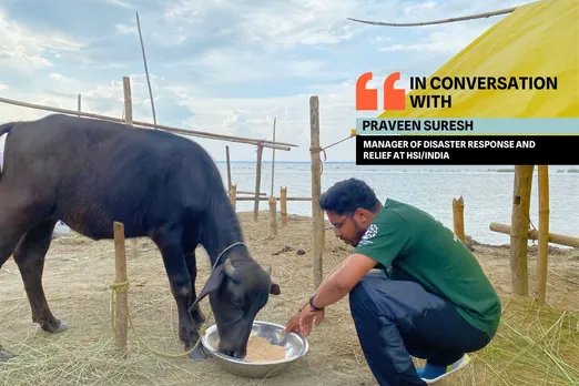 Praveen Suresh,  Manager of disaster response and relief at Humane Society International/ India feeding rescued cattle.