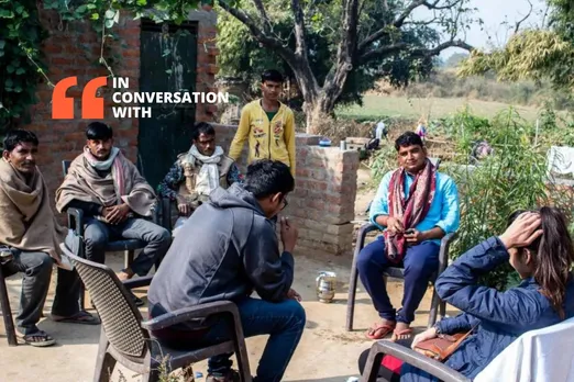 Radhika and Shail sits with the villagers on their walk along the Betwa.