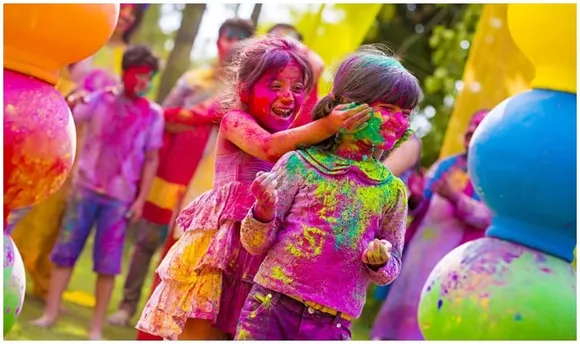 India, hit by surge in Covid cases, limits Holi festival celebrations
