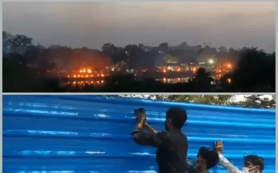 Mass cremation of COVID-19 victims, A wall comes up to block view
