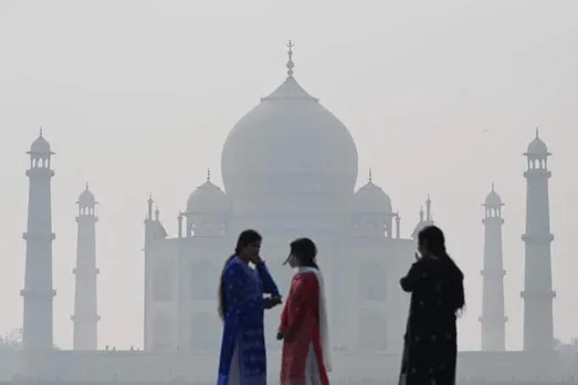 Tourists and smog camps at the Taj Mahal