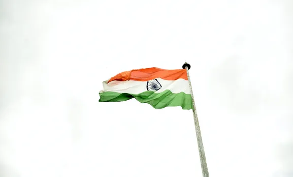 the national flag of india waving on a flag pole