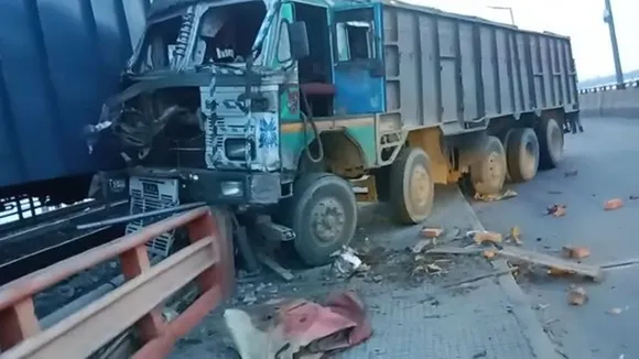 lorry broke the railing of the railway line and hit the moving freight train