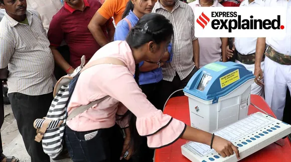 A first-time voter checking the VVPAT machine during the Election Commission's awareness campaign among voters in West Bengal in 2019.