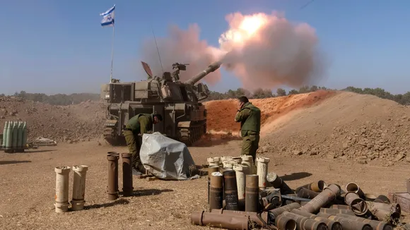 An Israeli mobile artillery unit fires a shell from southern Israel towards the Gaza Strip, in a position near the Israel-Gaza border. (AP)