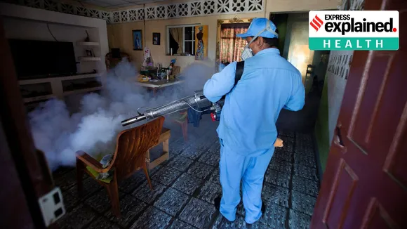 A worker of Nicaragua's health ministry fumigates the interior of a house to prevent the spread of dengue fever and other mosquito-borne diseases, in Managua, Nicaragua, November 27, 2023.