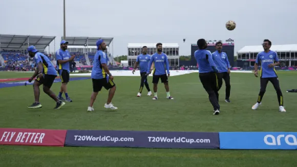 India vs Australia, Weather forecast: India's captain Rohit Sharma, second left, and teammates play with a soccer ball after wet outfield delayed the start of the ICC Men's T20 World Cup cricket match between Canada