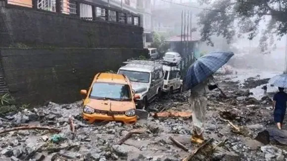 Vehicles stuck in mud and silt following landslides triggered by incessant rainfall, in North Sikkim